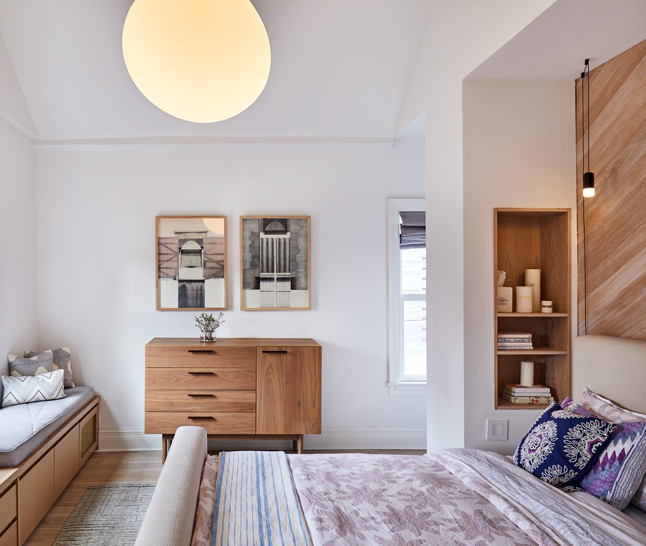 Custom white oak headboard and bedside lamps in the master bedroom by Alison Milne Design 