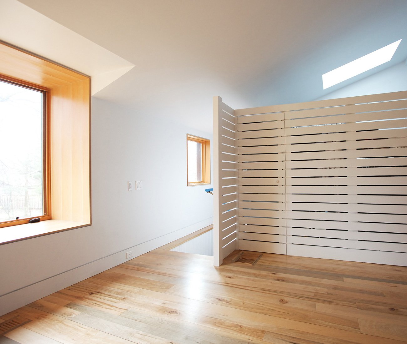 bathroom and storage area are concealed by a partition