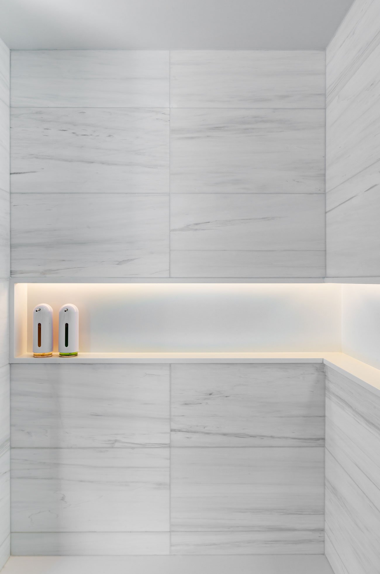 Recessed LED-lit shelf in the shower
