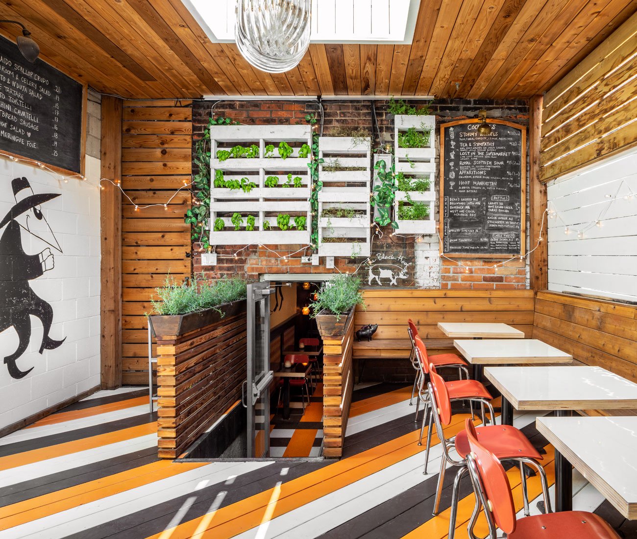 Bar Vendetta in Toronto, Fresh herbs along the wall near the seating area